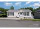 Charming single-story home with tidy landscaping, well-lit entry, and inviting curb appeal at 161 Badin Lake Cir, New London, NC 28127
