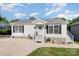 Inviting one-story home boasting well-maintained landscaping and a neatly paved driveway at 161 Badin Lake Cir, New London, NC 28127