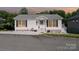 Charming one-story home featuring a welcoming front entrance and manicured landscaping at 161 Badin Lake Cir, New London, NC 28127