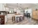 Open kitchen and dining area with an island and ample natural light at 161 Badin Lake Cir, New London, NC 28127