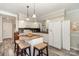 Bright kitchen featuring a kitchen island, white cabinetry, and stainless steel appliances at 161 Badin Lake Cir, New London, NC 28127