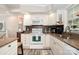 Well-equipped kitchen with white cabinets, granite countertops, and modern appliances at 161 Badin Lake Cir, New London, NC 28127