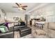 Open-concept living room with a leather sofa, breakfast bar, and stylish decor at 161 Badin Lake Cir, New London, NC 28127
