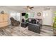 Cozy living room with comfortable seating, a ceiling fan, and a view of the front yard at 161 Badin Lake Cir, New London, NC 28127