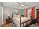 Cozy bedroom with a decorative rug, wood furniture, and natural light at 161 Badin Lake Cir, New London, NC 28127
