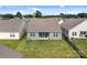 Aerial view of the backyard, featuring a covered patio and lush lawn at 161 Pampas Pl, Statesville, NC 28625
