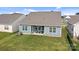 Well maintained backyard with covered patio and seating area at 161 Pampas Pl, Statesville, NC 28625
