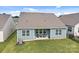 Lovely backyard featuring a covered patio and ample green space for outdoor activities at 161 Pampas Pl, Statesville, NC 28625