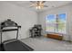 Light-filled home office complete with treadmill, desk, and a large window at 161 Pampas Pl, Statesville, NC 28625