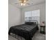 Calm bedroom featuring a cozy bed, ceiling fan, and a window providing natural light at 161 Pampas Pl, Statesville, NC 28625