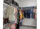 Walk-in closet with metal shelving and hanging racks providing ample storage space for clothing and accessories at 161 Pampas Pl, Statesville, NC 28625