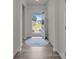 Bright entryway with beautiful wood-look flooring and an open view to the outside at 161 Pampas Pl, Statesville, NC 28625