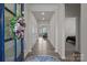 Bright entryway with beautiful wood-look flooring, leading to a comfortable living area and private bedroom at 161 Pampas Pl, Statesville, NC 28625
