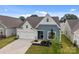 Exterior home view displaying the charming curb appeal with a two car garage and landscaping at 161 Pampas Pl, Statesville, NC 28625