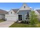 Attractive home features a well-manicured lawn and a spacious two-car garage at 161 Pampas Pl, Statesville, NC 28625