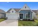 Charming home with a two-car garage and well-manicured landscaping at 161 Pampas Pl, Statesville, NC 28625