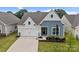 Well-maintained home showcasing its appealing facade and inviting landscaping at 161 Pampas Pl, Statesville, NC 28625