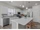 Beautiful kitchen boasts white cabinets, granite countertops, and stainless steel appliances at 161 Pampas Pl, Statesville, NC 28625