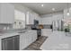Well-lit kitchen with stainless steel appliances, modern cabinets, and a sleek design at 161 Pampas Pl, Statesville, NC 28625