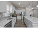 Spacious kitchen showcasing a large island, stainless steel appliances, and stylish cabinets at 161 Pampas Pl, Statesville, NC 28625