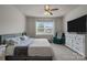 Comfortable bedroom with soft carpet, ceiling fan, flat screen TV, and large window at 161 Pampas Pl, Statesville, NC 28625