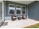 Covered patio with blue siding, with furniture to enjoy the outdoors, creating a relaxing outdoor living space at 161 Pampas Pl, Statesville, NC 28625