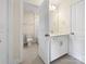 Well-lit bathroom with neutral paint, a tile floor, and a combination tub and shower at 163 W Heart Pine Ln, Statesville, NC 28677