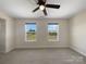Bright room with two windows looking out to a grassy yard at 163 W Heart Pine Ln, Statesville, NC 28677