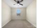 Cozy bedroom featuring neutral walls and carpet with a window providing natural light at 163 W Heart Pine Ln, Statesville, NC 28677