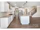 Open-concept kitchen featuring granite countertops, stainless steel appliances, and a large center island at 163 W Heart Pine Ln, Statesville, NC 28677