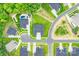 Aerial view of neighborhood home with pool, lush greenery, and a well-maintained landscaped yard at 1702 Batson Creek Ln, Weddington, NC 28104