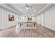 Spacious basement area perfect for recreation with a ping pong table, lighting, and decor at 1702 Batson Creek Ln, Weddington, NC 28104