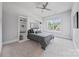 This is a bedroom that has a built-in murphy bed, shelving, and a view of the neighborhood at 1702 Batson Creek Ln, Weddington, NC 28104