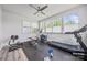 Bright home gym with large windows and an assortment of exercise equipment at 1702 Batson Creek Ln, Weddington, NC 28104