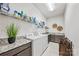 Spacious laundry room with washer, dryer, granite countertops, and ample storage at 1702 Batson Creek Ln, Weddington, NC 28104