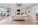 Living room includes a fireplace, backyard access, and modern decor with an open floor plan at 1702 Batson Creek Ln, Weddington, NC 28104