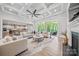 Living room features a coffered ceiling, fireplace, access to the porch, and an open floor plan at 1702 Batson Creek Ln, Weddington, NC 28104