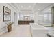 This is a main bathroom featuring an open shower, soaking tub, double vanity, and plenty of recessed lighting at 1702 Batson Creek Ln, Weddington, NC 28104
