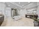 This is a main bathroom featuring an open shower, soaking tub, double vanity, and plenty of recessed lighting at 1702 Batson Creek Ln, Weddington, NC 28104