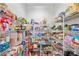 Walk-in pantry with wire shelving and ample storage space for food and kitchen supplies at 1702 Batson Creek Ln, Weddington, NC 28104