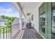 Relaxing covered porch featuring outdoor seating and a charming green door at 1702 Batson Creek Ln, Weddington, NC 28104