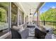 Spacious covered porch with outdoor seating arrangements, ideal for entertaining at 1702 Batson Creek Ln, Weddington, NC 28104