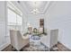 Sitting area showcases a decorative ceiling, wainscoting, neutral colors, and a modern chandelier at 1702 Batson Creek Ln, Weddington, NC 28104