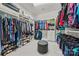 This is a walk-in closet with shelving, drawers, and plenty of hanging storage at 1702 Batson Creek Ln, Weddington, NC 28104
