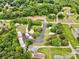 An expansive aerial view showcases homes with generous green spaces, outbuildings and road access at 1733 S Nc 16 Business Hwy, Stanley, NC 28164