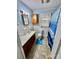 Cozy blue bathroom with a single sink, a cabinet, and a shower/tub combo at 1733 S Nc 16 Business Hwy, Stanley, NC 28164