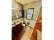 Compact bathroom featuring double sinks, natural light, and a pegboard cabinet at 1733 S Nc 16 Business Hwy, Stanley, NC 28164