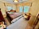 Comfortable bedroom featuring carpet, paneled walls, and natural light at 1733 S Nc 16 Business Hwy, Stanley, NC 28164