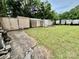 Outbuildings in a grassy yard offer extra storage, with mature trees and a quiet atmosphere at 1733 S Nc 16 Business Hwy, Stanley, NC 28164
