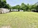Grassy lot showing multiple outbuildings and storage trailers offer lots of exterior storage potential at 1733 S Nc 16 Business Hwy, Stanley, NC 28164